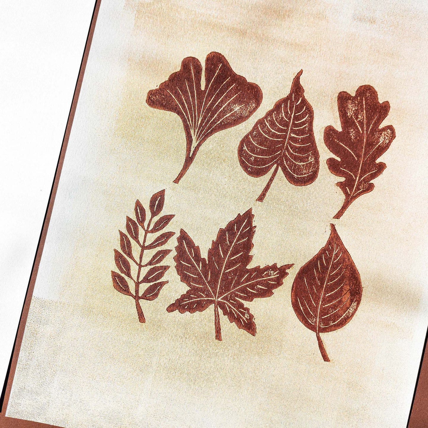 Brown and gold gallery wall set of 2 linocut print woodblock leaves wood slice original artwork cottagecore autumn wall art bedroom decor one of a kind farmhouse gift linogravure printmaking grandmother gift, thoughtful teacher gift, grandma gift, going away gift for coworker, godparent gift, godmother gift, girlfriend gift, One of a Kind Fall Gift, Gratitude Gift for Mentor, gift for the home, gift for best friend, female, foraged wall art, Floral wall art