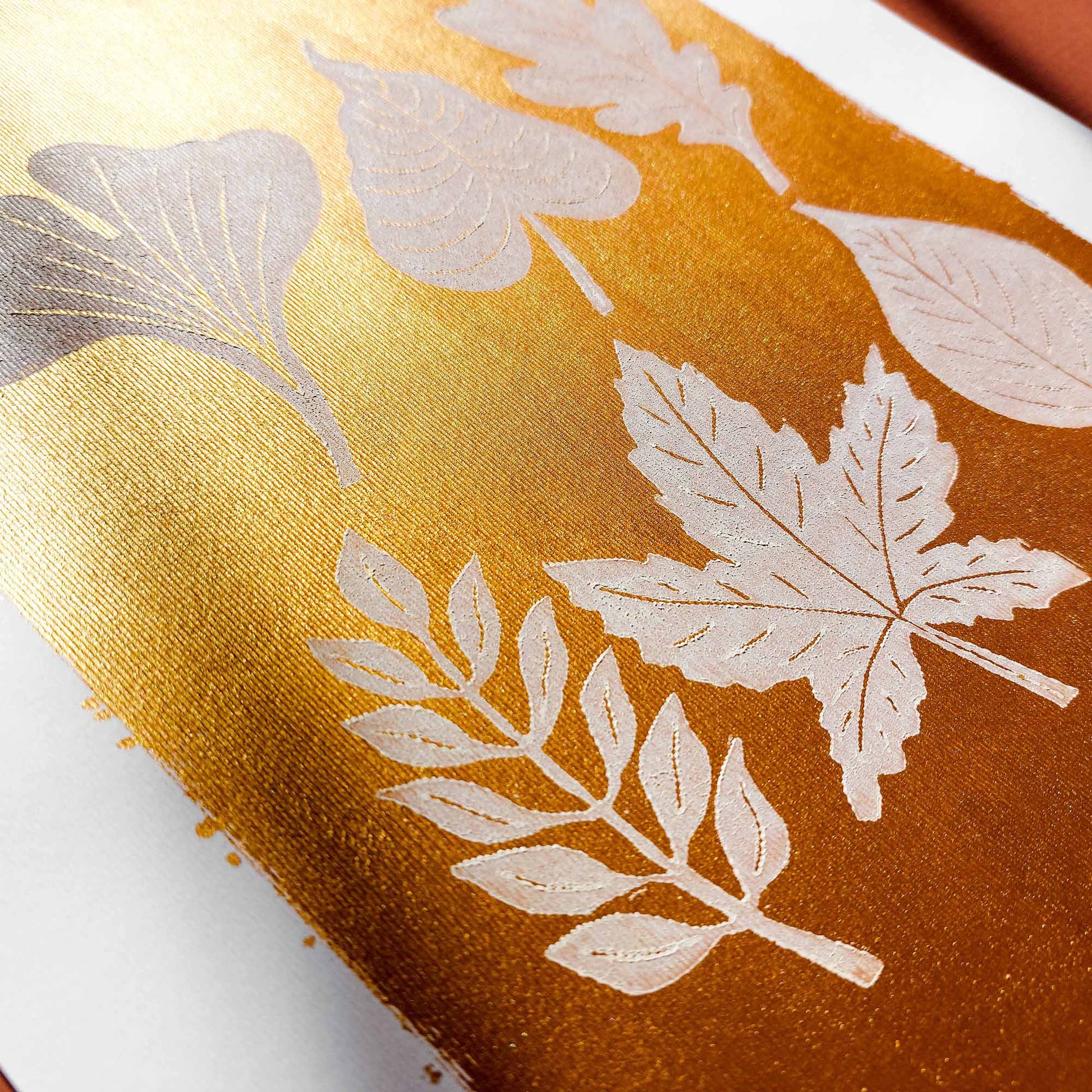 gold acrylic white oil ink autumn wall art linocut print white leaves foraged rustic fall new home gift original artwork thanksgiving table hallway decor grandmother hostess gift one of a kind linogravure botanical office lino cottagecore nature lover leaf farmhouse thank you bedroom printmaking handprinted farm minimalist self sister mom mother hostess new apartment godmother wife woman living room kitchen handmade dining for Her Thankful Gratitude Entryway Dorm Warm Earth Tones Seasonal