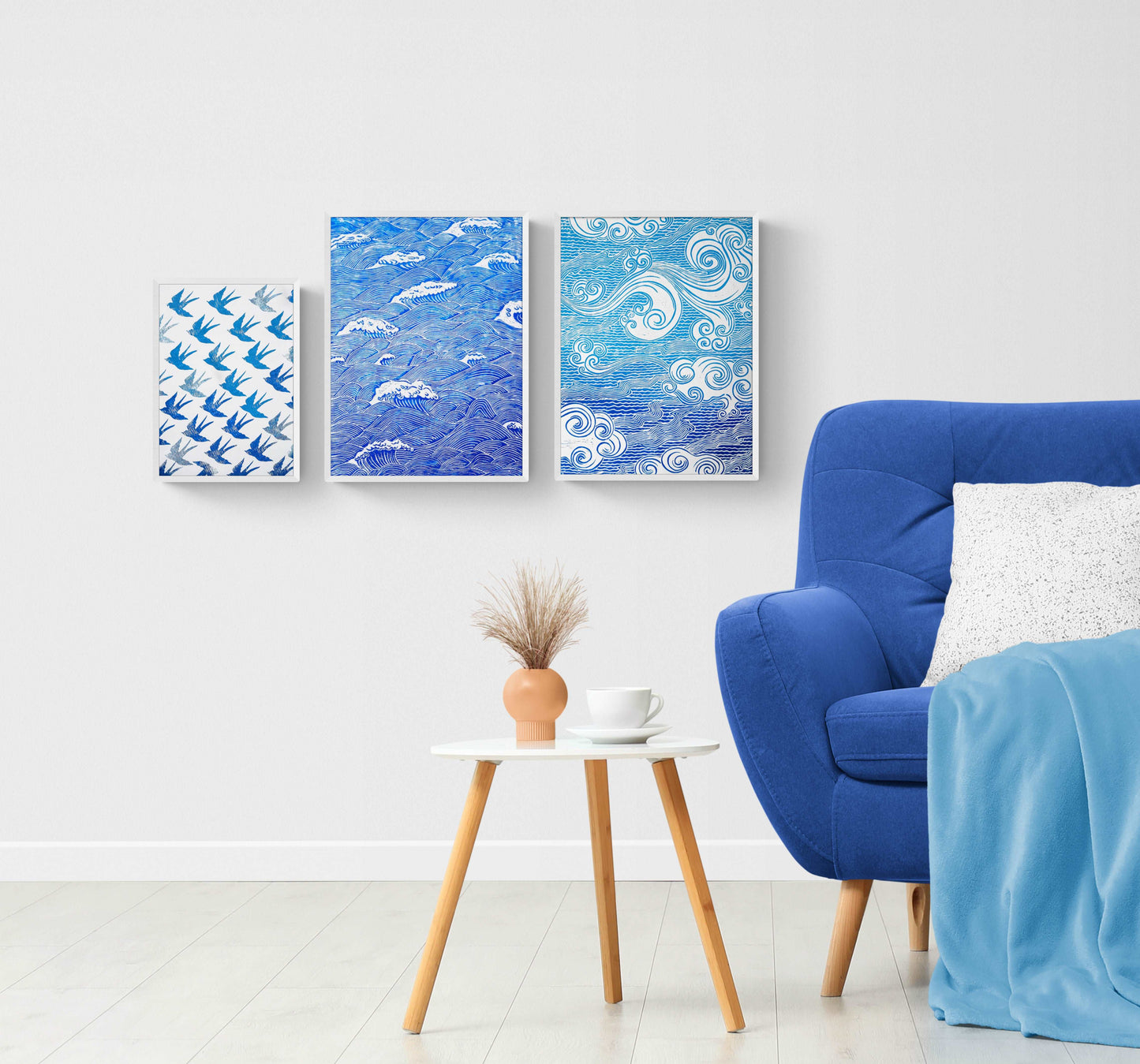 gallery wall with blue japanese waves and clouds and digital poster blue birds in living room